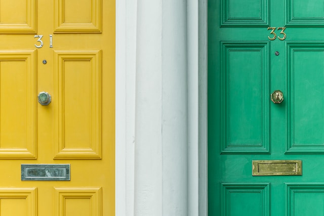 Green and yellow neighbours doors.